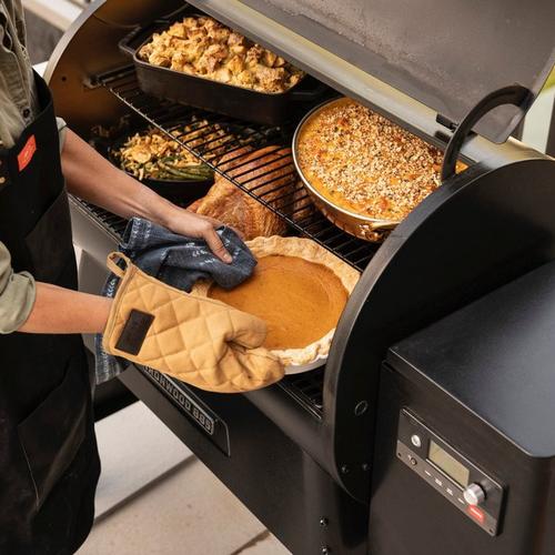Traeger-BBQ-Mitts-being-used-to-carry-hot-trays-of-food.jpeg Traeger-BBQ-Mitts-being-used-to-carry-hot-trays-of-food.jpeg